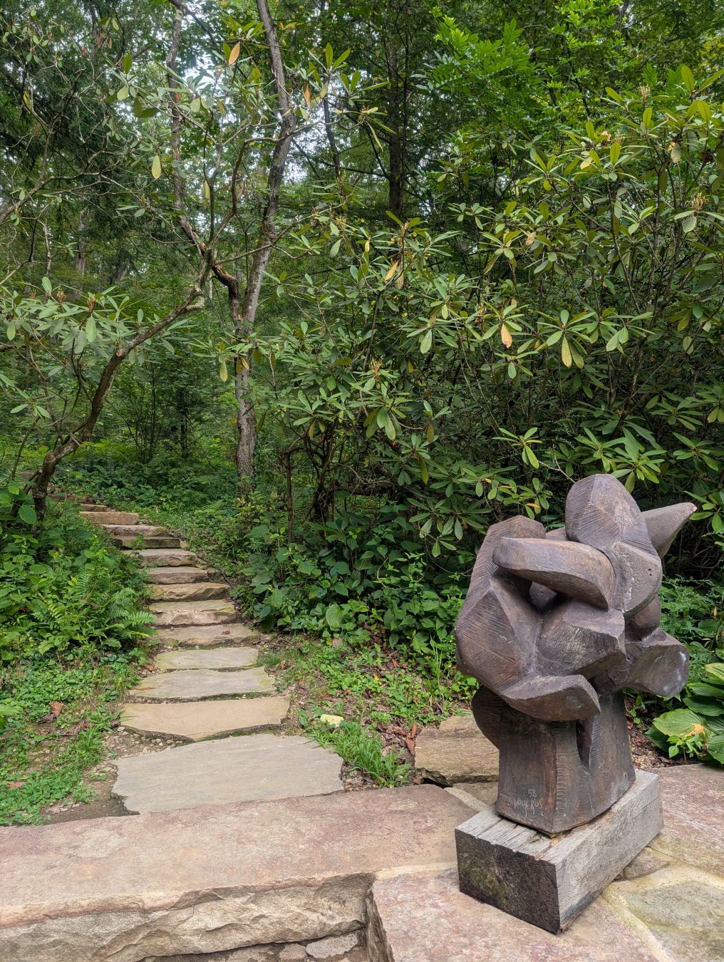 Statue and stars between trees at Fallingwater